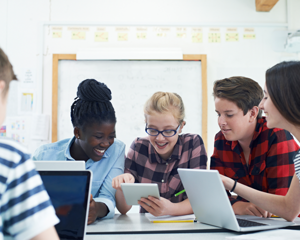 Students using devices in school Image of students using devices in school